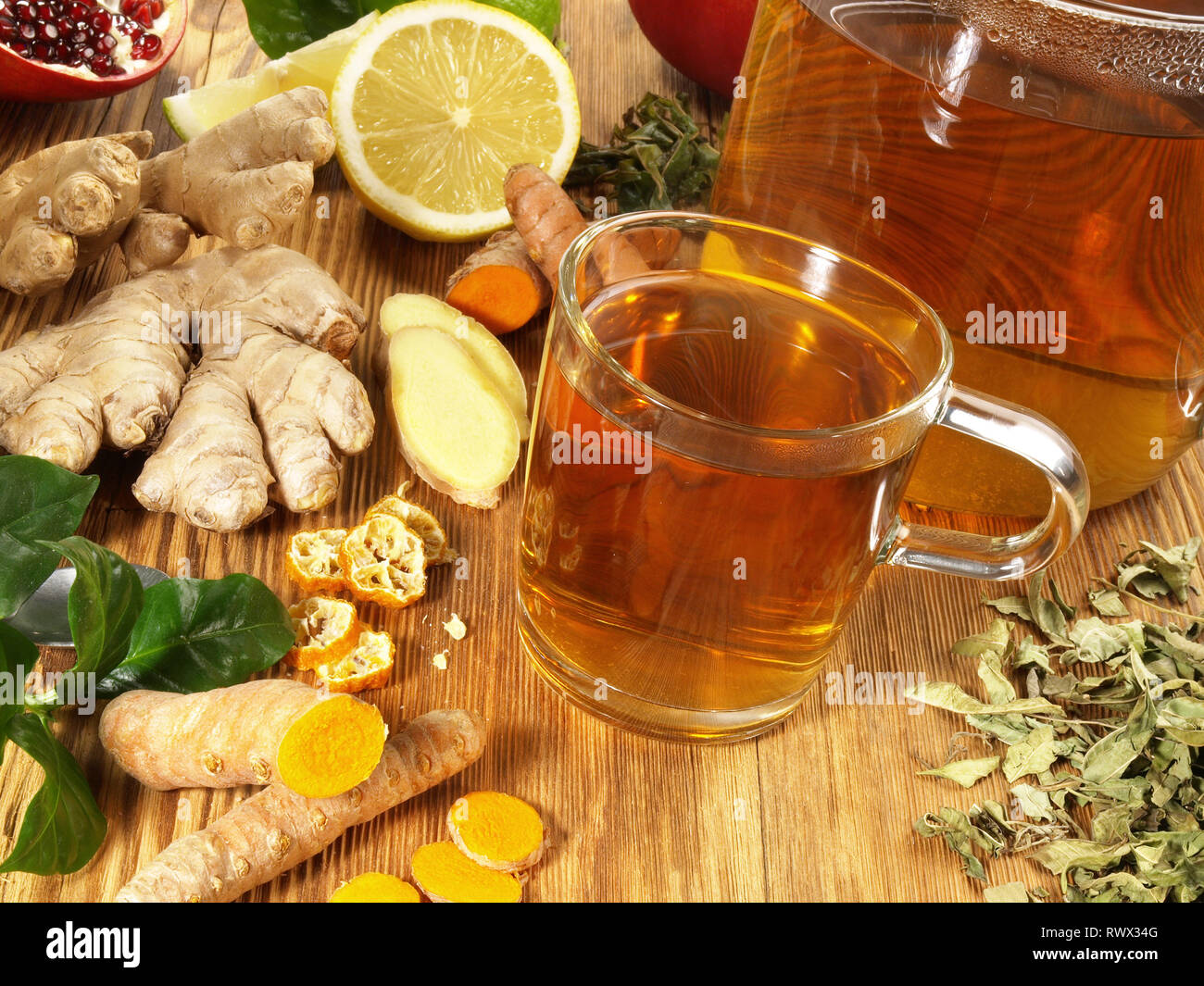 Tea with different ingredients on wooden Background Stock Photo