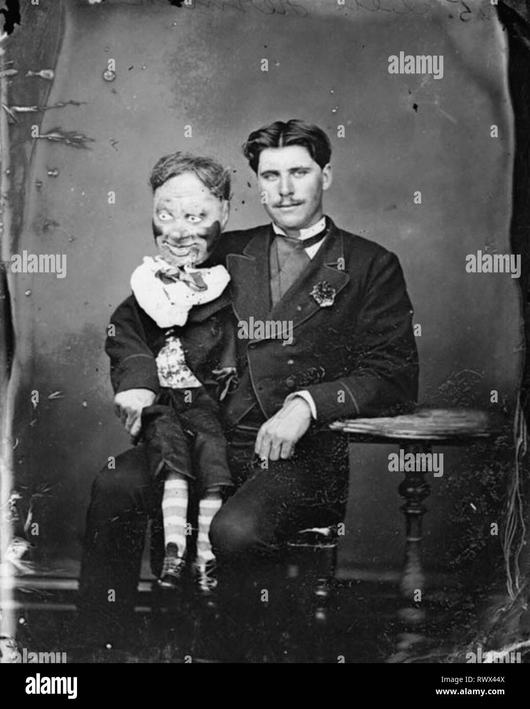 Creepy ventriloquist with his horrific dummy Stock Photo