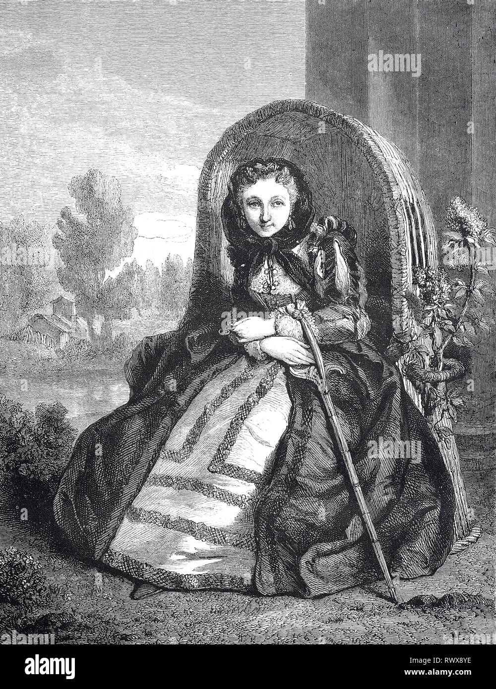 Junge Frau in der Verkleidung einer alten Frau in einem Sessel im Garten, Frankreich / Young woman in disguise of an old woman in an armchair in the garden, France Stock Photo