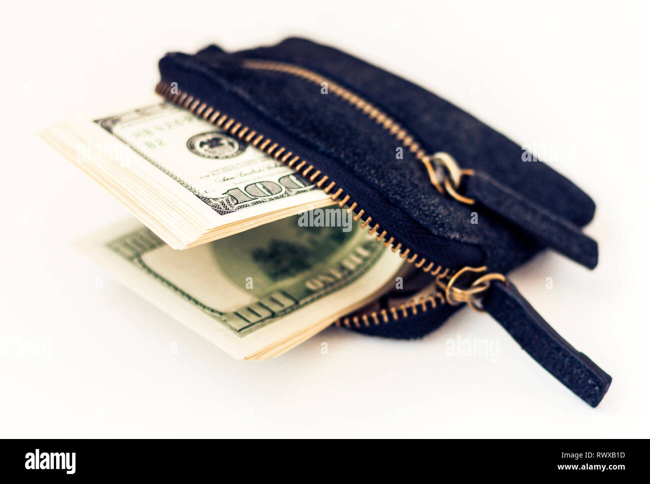 Black suede leather wallet isolated on white background with dollars Stock Photo
