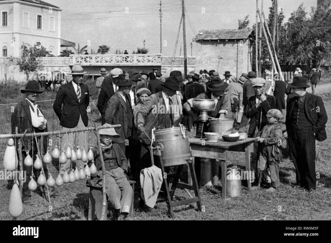 Europe, Italy, Calabria, Sant'Eufemia, demonstration of a machine during the agricultural fair, 1920-30 Stock Photo