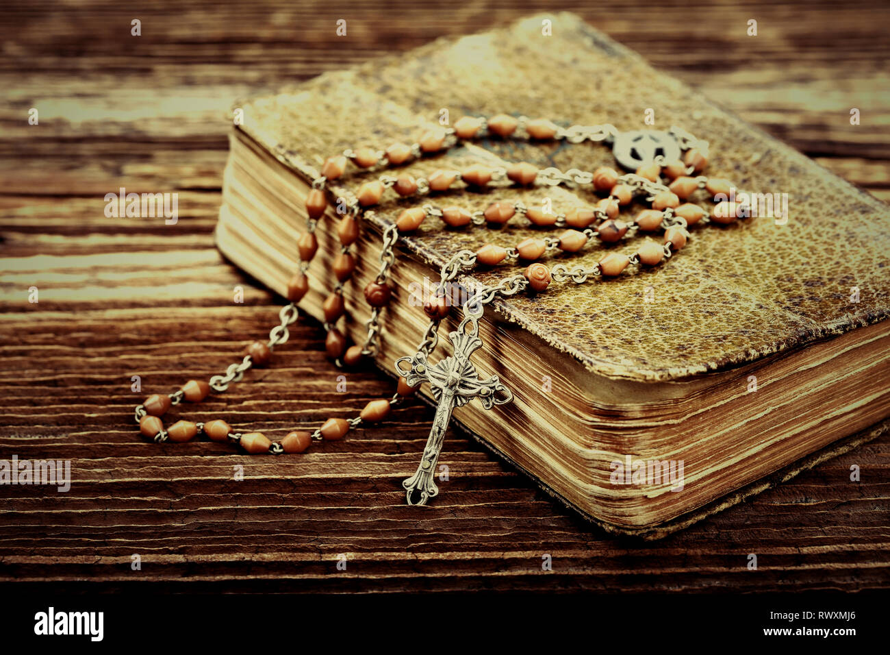 Old prayer book and rosary, close up vintage view with empty space for