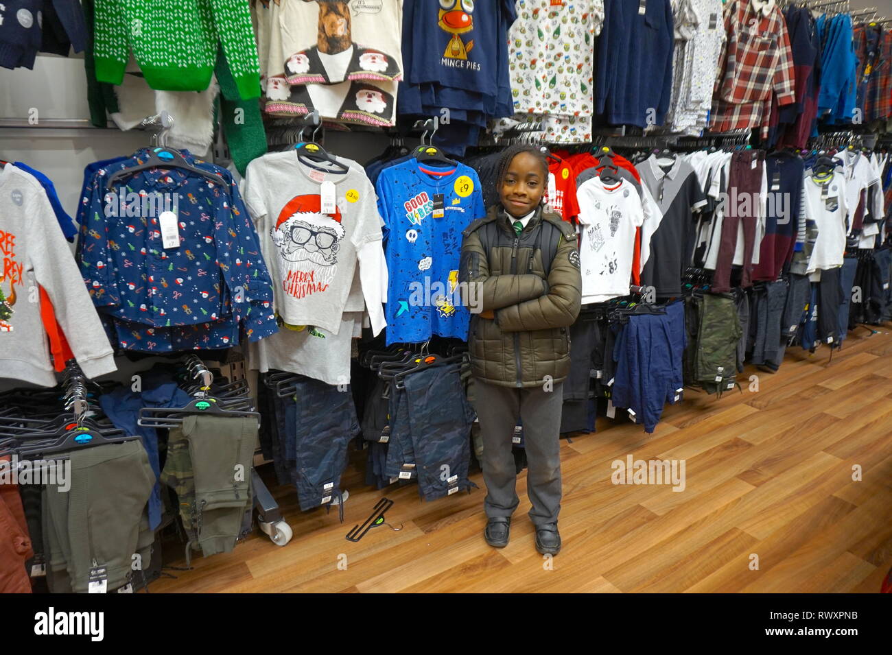 Young AfroCaribbean boy in Asda Superstore, Colindale, London Stock