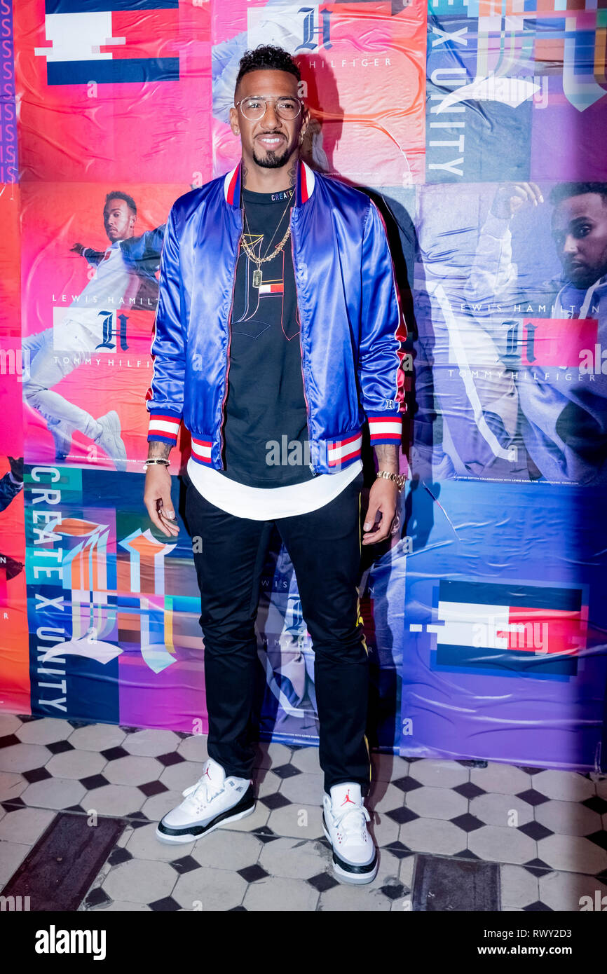 Berlin, Germany. 07th Mar, 2019. Jerome Boateng, football player, stands in  front of a photo wall at the Tommy Hilfiger CREATExUNITY event. Credit:  Christoph Soeder/dpa/Alamy Live News Stock Photo - Alamy