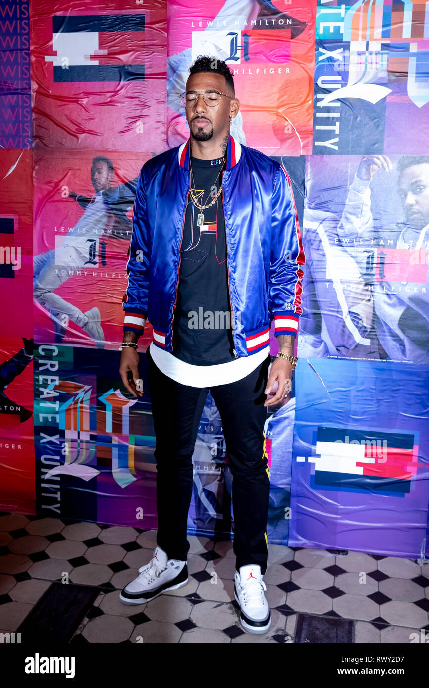 Berlin, Germany. 07th Mar, 2019. Jerome Boateng, football player, stands in  front of a photo wall at the Tommy Hilfiger CREATExUNITY event. Credit:  Christoph Soeder/dpa/Alamy Live News Stock Photo - Alamy