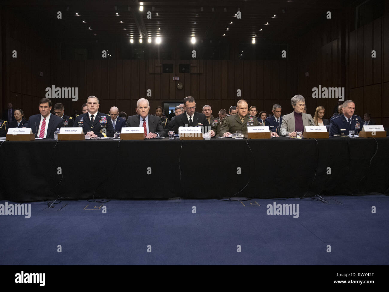 March 7, 2019 - Washington, District of Columbia, U.S. - From left to right: United States Secretary of the Army Dr. Mark T. Esper; US Army General Mark A. Milley, Chief of Staff of the Army; US Secretary of the Navy Richard V. Spencer; US Navy Admiral John M. Richardson, Chief of Naval Operations; US Marine Corps General Robert B. Neller, Commandant of the Marine Corps; US Secretary of the Air Force Heather Wilson; and US Air Force General David L. Goldfein, Chief of Staff of the Air Force testify before the US Senate Committee on Armed Services during a hearing on ''Chain of Command's Acco Stock Photo