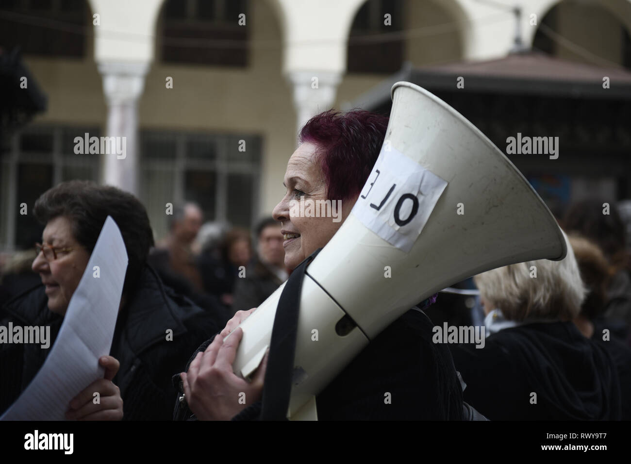 Thessaloniki, Greece. 8th Mar, 2019. A woman holds a speaker during a protest. Due to International Women's Day women of the Hellenic Women Federation demonstrated at the center of the city, demanding equal rights with men in the labor sector and improvement on the working conditions of working mothers. Credit: Giannis Papanikos/ZUMA Wire/Alamy Live News Stock Photo