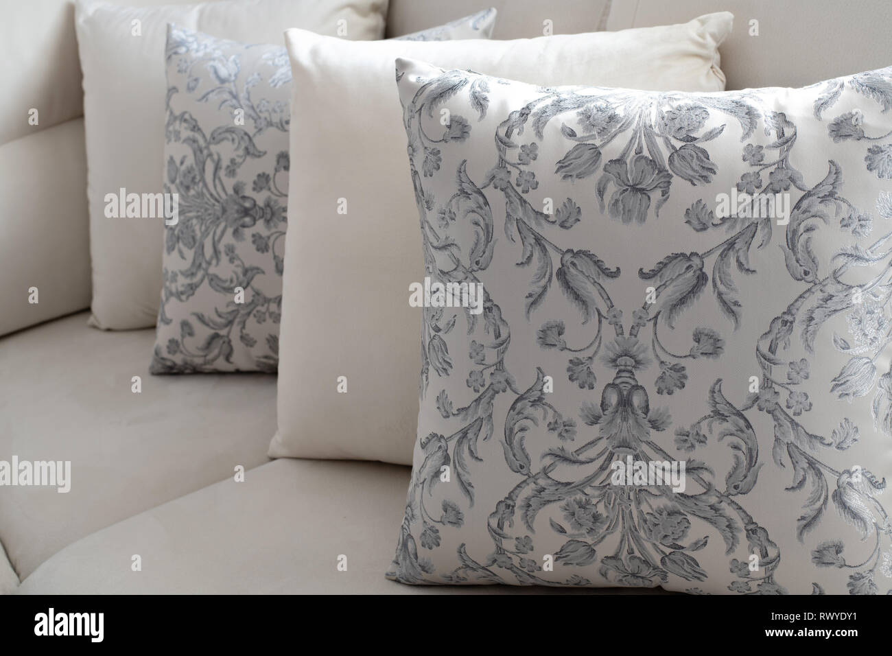 A several pillow on the light sofa Stock Photo