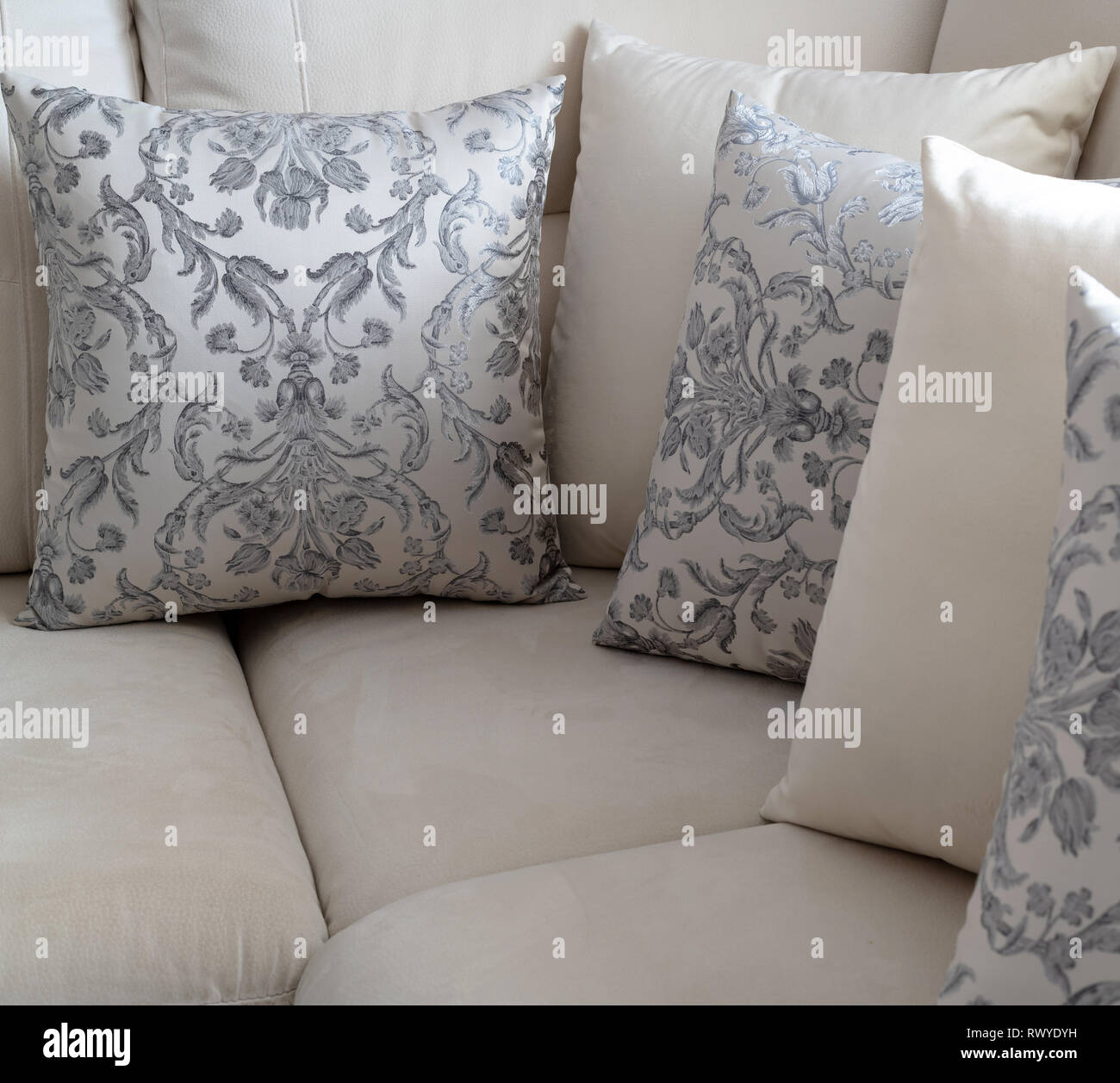 A several pillow on the light sofa Stock Photo