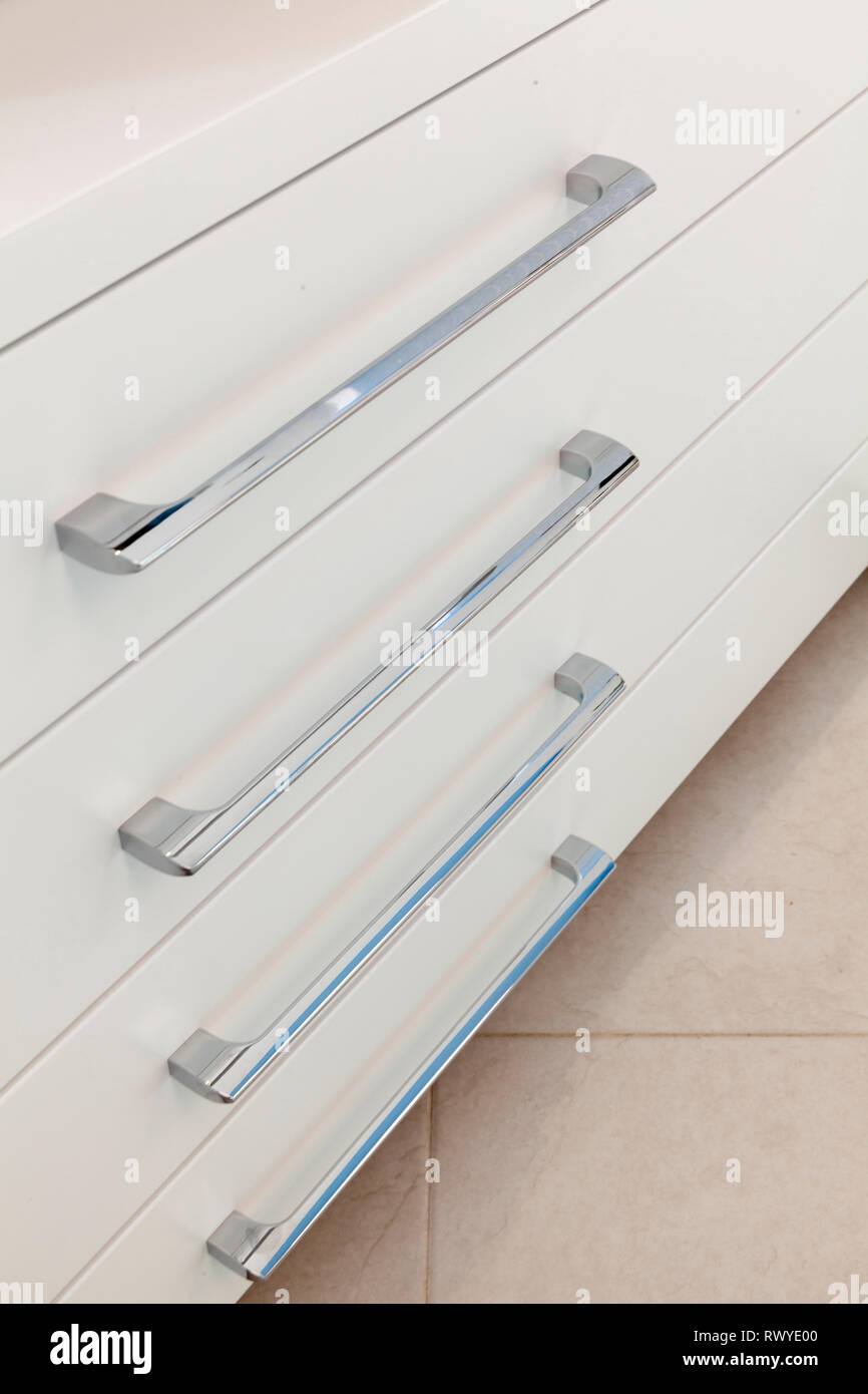 White chest with drawers and silver handles Stock Photo Alamy