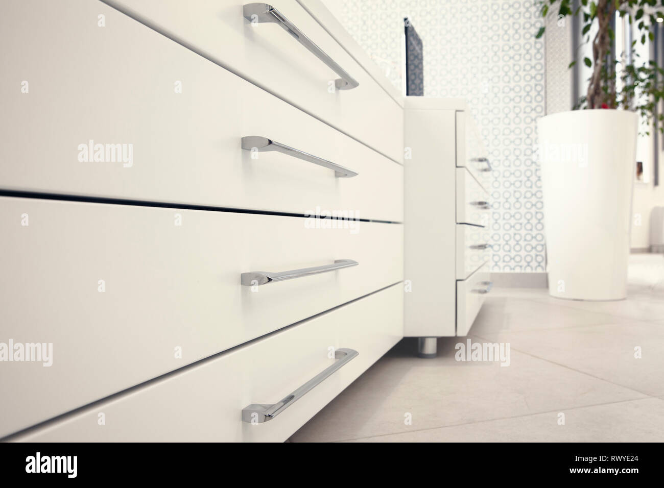 White chest with drawers and silver handles Stock Photo Alamy