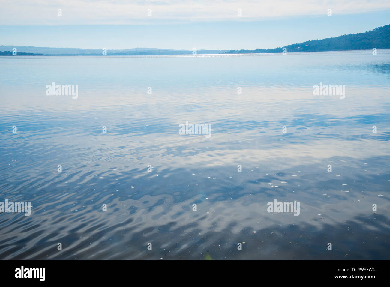 Sky reflected on lake water. Stock Photo
