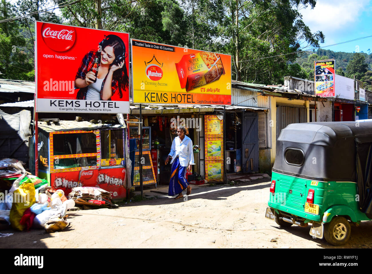 Sri Lankan in sarong, stores shops, tuk tuk, Nuwara Eliya, Sri Lanka