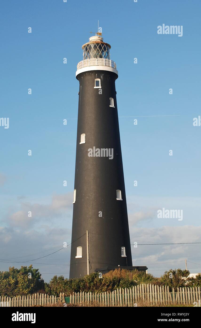 The old lighthouse at Dungeness in Kent, England on January 27, 2014. Opened in 1904, it was decommissioned in 1960. Stock Photo