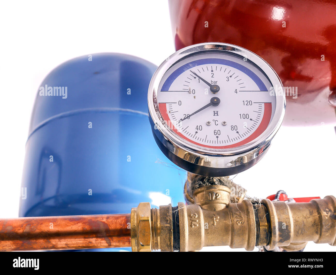 Pressure gauge mounted on copper piping system with expansion tanks in