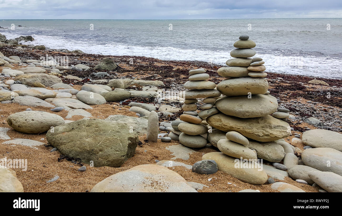 Isle of Wight, United Kingdom August 28, 2018 rock balancing, a pile of stones balanced on