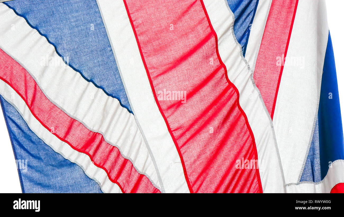 Details of the red blue and white flag of England. It is waving on the
