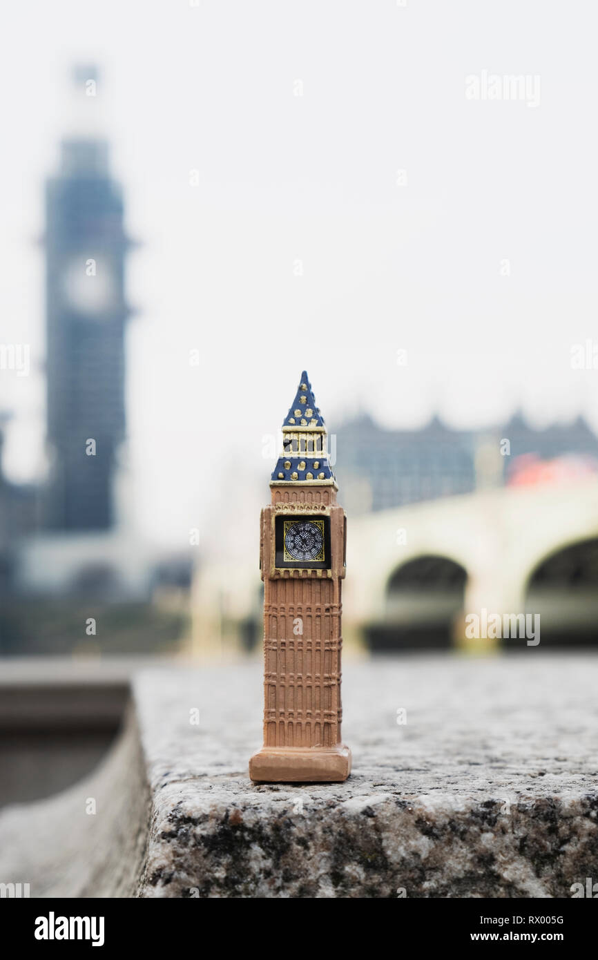 a miniature of the Clock Tower in front of the original tower of the Palace of Westminster in London, United Kingdom Stock Photo