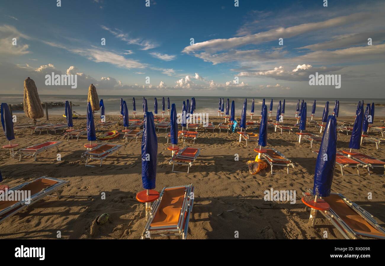 Lido beach with umbrellas ready for the new season Stock Photo