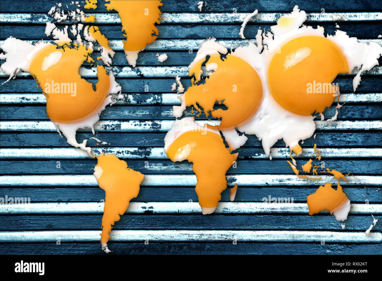 Fried eggs like a map of the earth in a barbecue grill. Concept for global warming Stock Photo