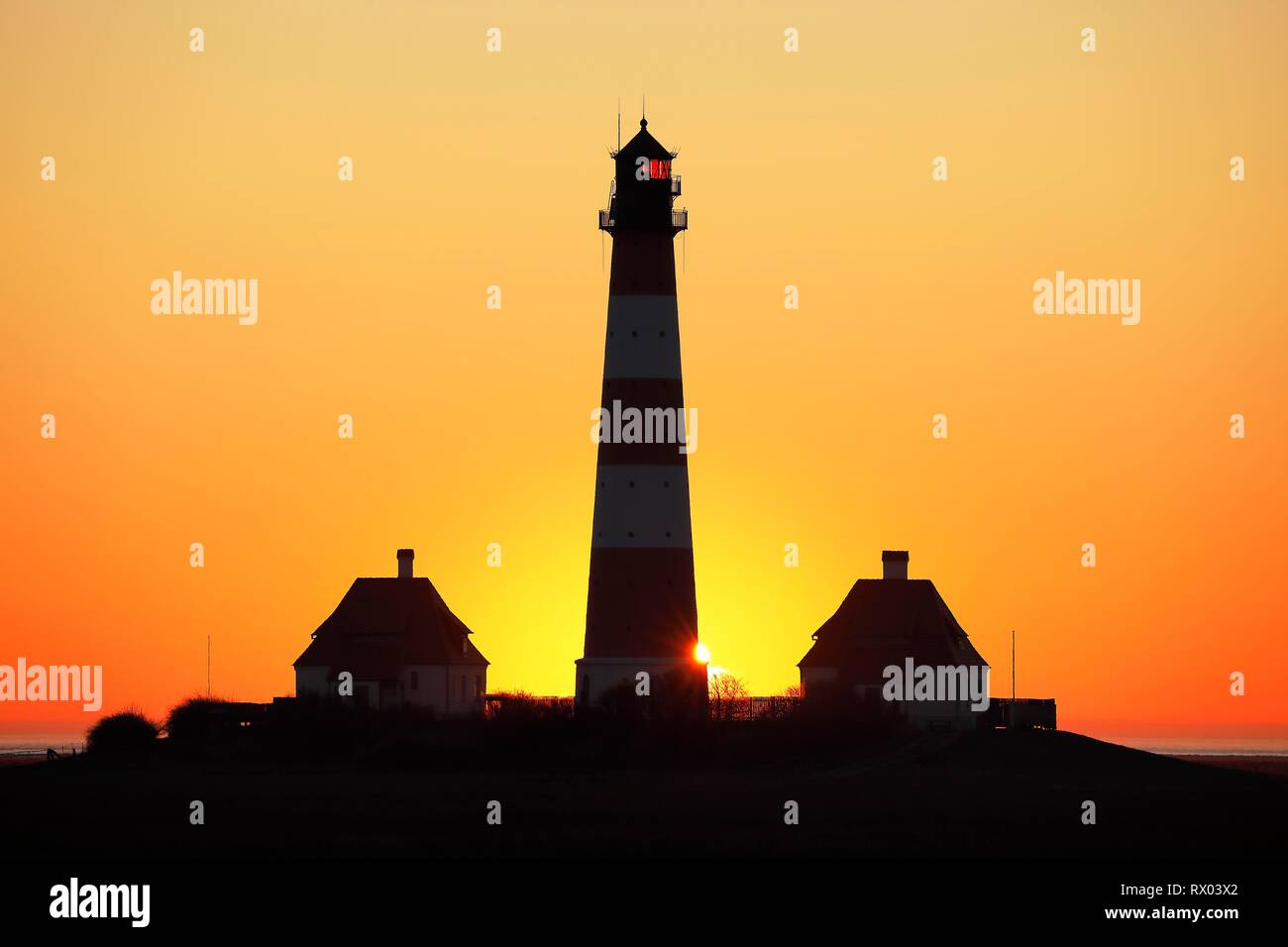 Lighthouse Westerheversand at sunset, Schleswig-Holstein Wadden Sea National Park, UNESCO World Heritage Site, Westerhever Stock Photo