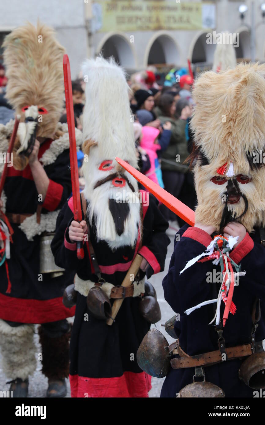 People in in traditional Kukeri costume are seen at the Festival of the ...