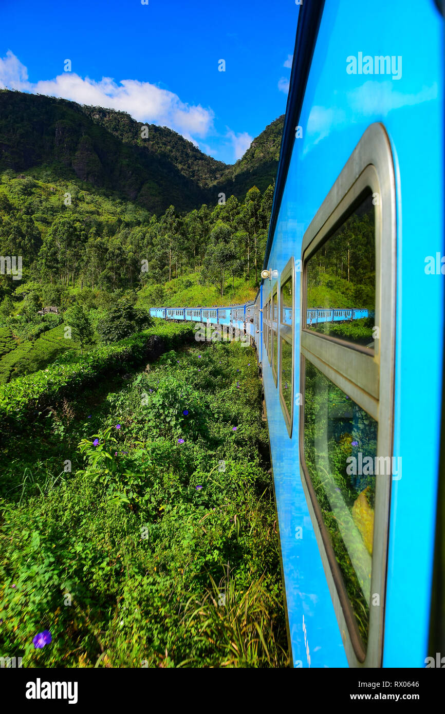 Sri Lankan Blue Train ride heading through hill country and tea plantations from Colombo to Kandy, Nuwara Eliya, Ella, Badulla, Sri Lanka Stock Photo