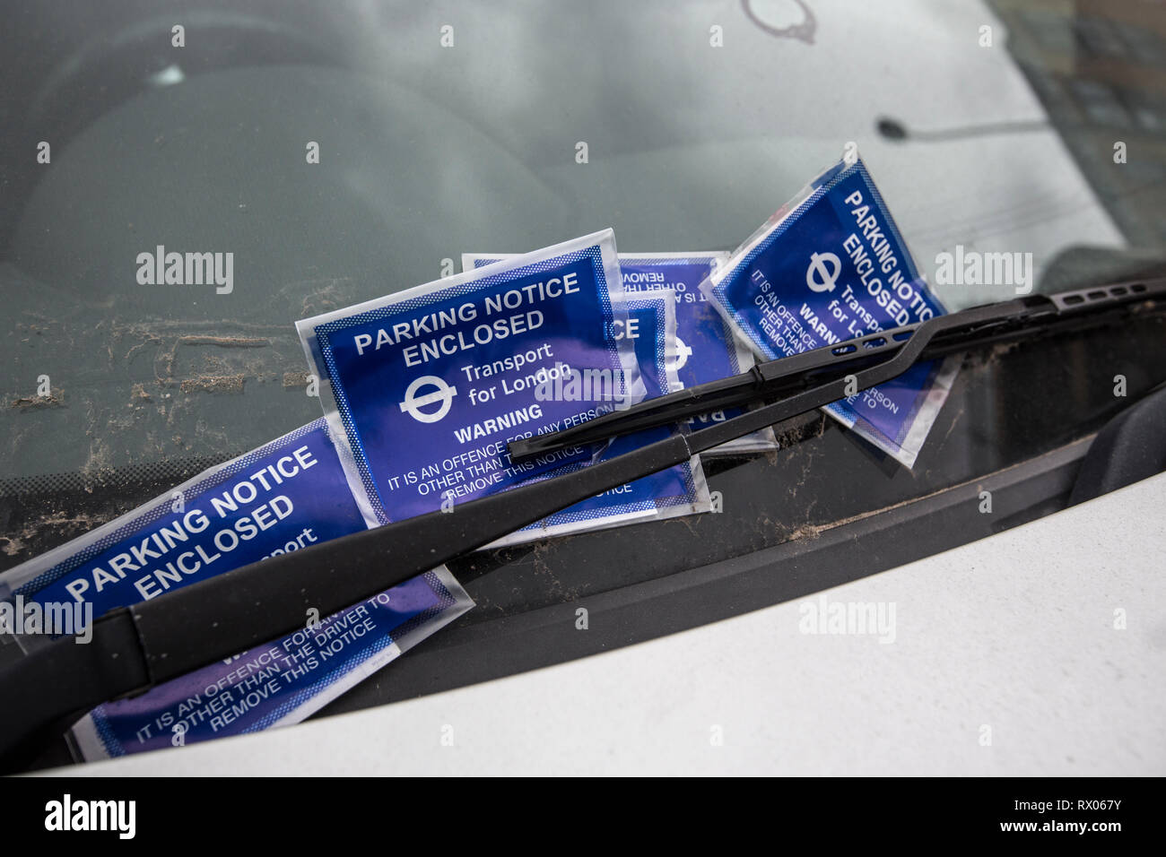 Parking Penalty Charge Notices placed on a drivers windscreen, London, England, UK Stock Photo