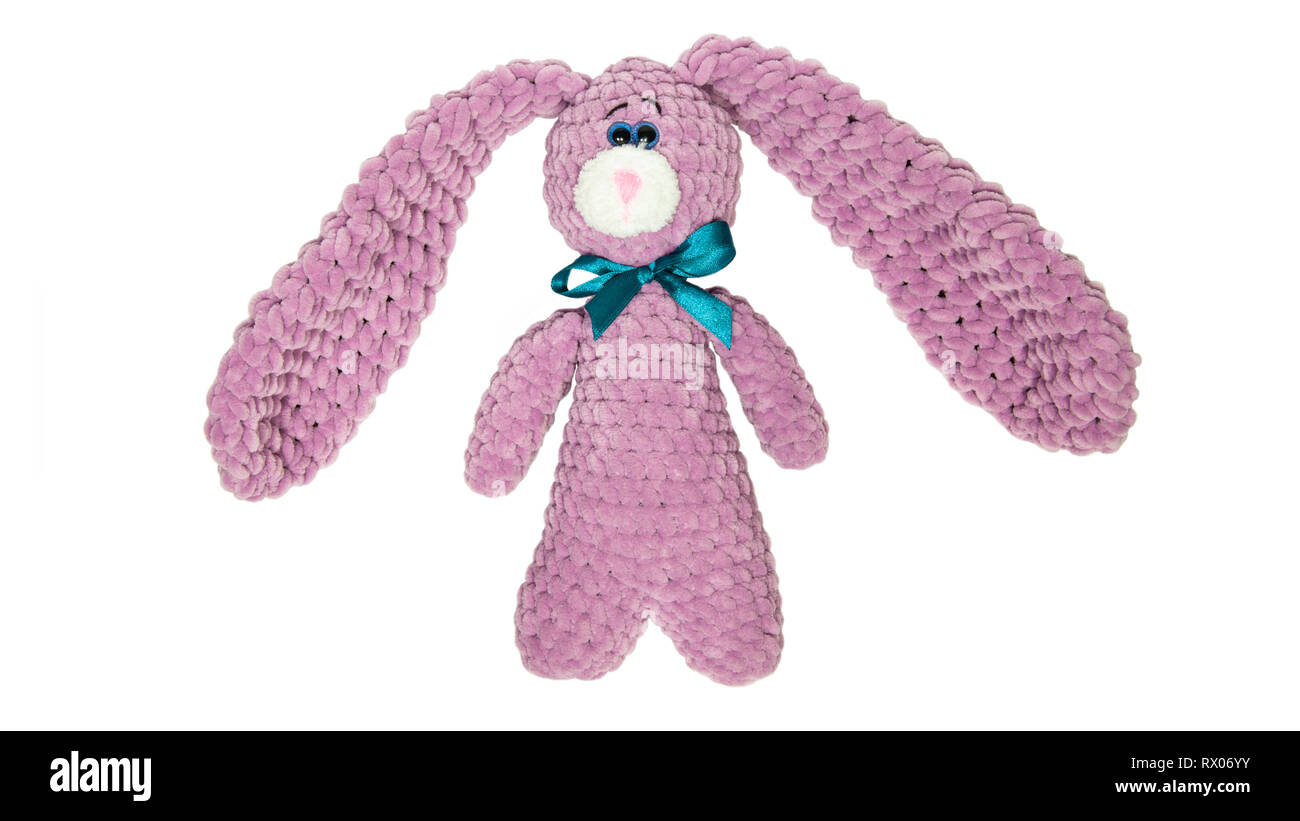 Toy pink bunny or hare with a bow on an isolated white background Stock ...