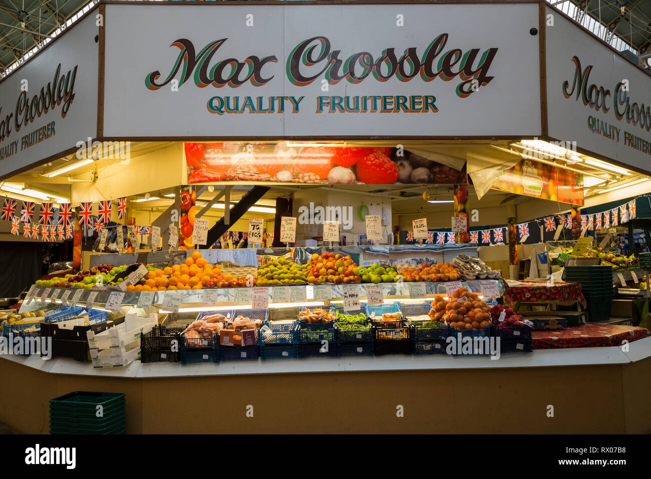 Max Crossley fruit & vegetable / fruiterer stall shop / stalls inside the interior of Borough Market; a Victorian covered indoor market in Halifax. UK Stock Photo