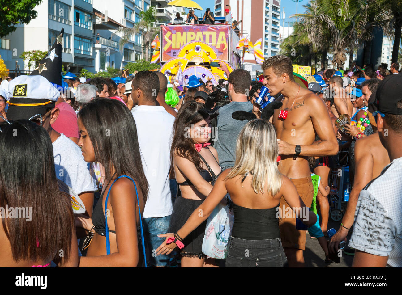 RIO DE JANEIRO - FEBRUARY 18, 2017: The iconic Simpatia é Quase Amore (Sympathy is Almost Love) banda Carnival street party in Ipanema draws crowds. Stock Photo
