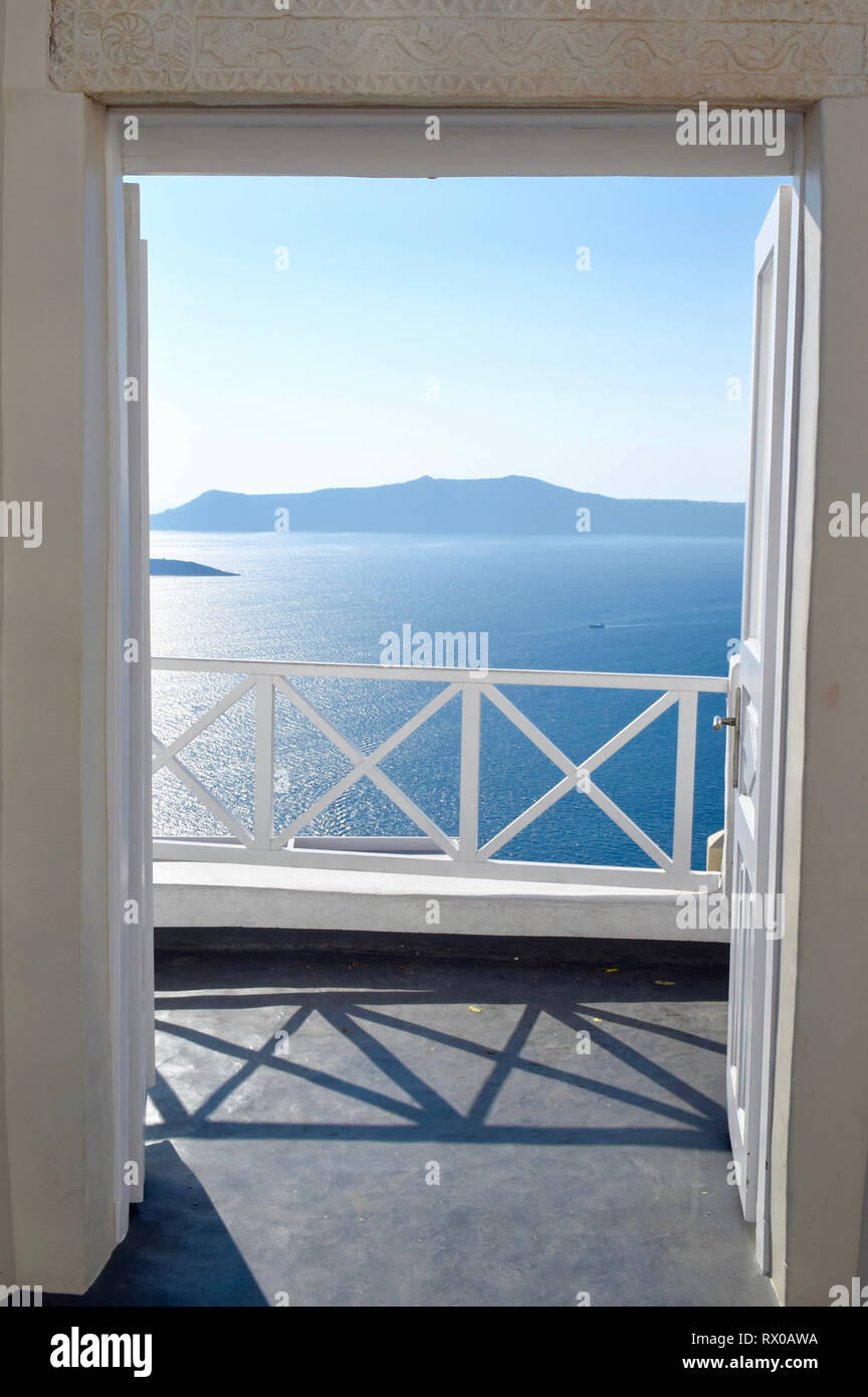 View of The Sea Mediterranean through the open door, Santorini, Greece Stock Photo