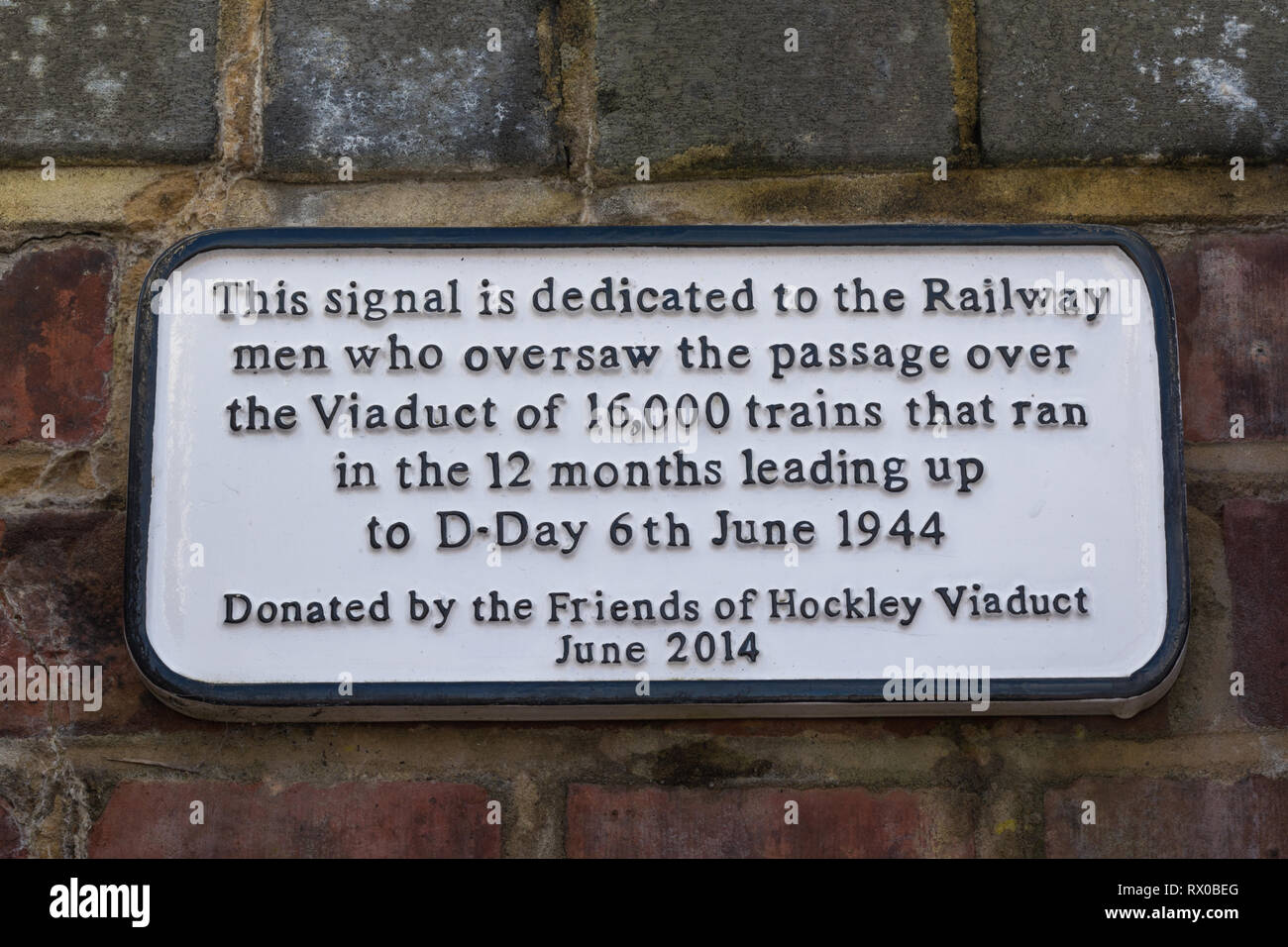 Plaque on Hockley Railway Viaduct near signal dedicated to railway men who oversaw passage of trains leading up to D-Day Stock Photo