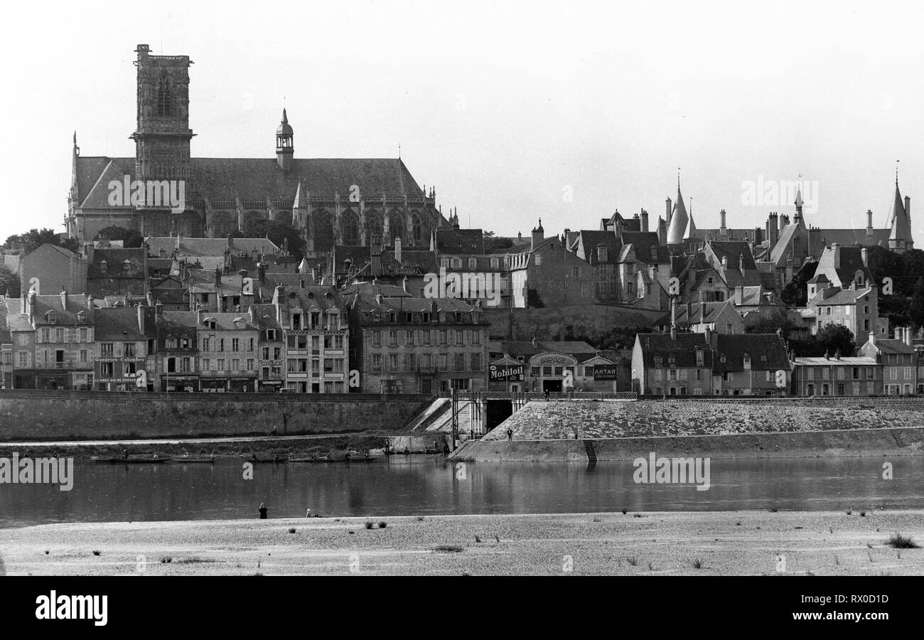 The city of Nevers, France looking across the Loire river with the Cathedral of St. Cyr and St. Julitte in 1927 Stock Photo