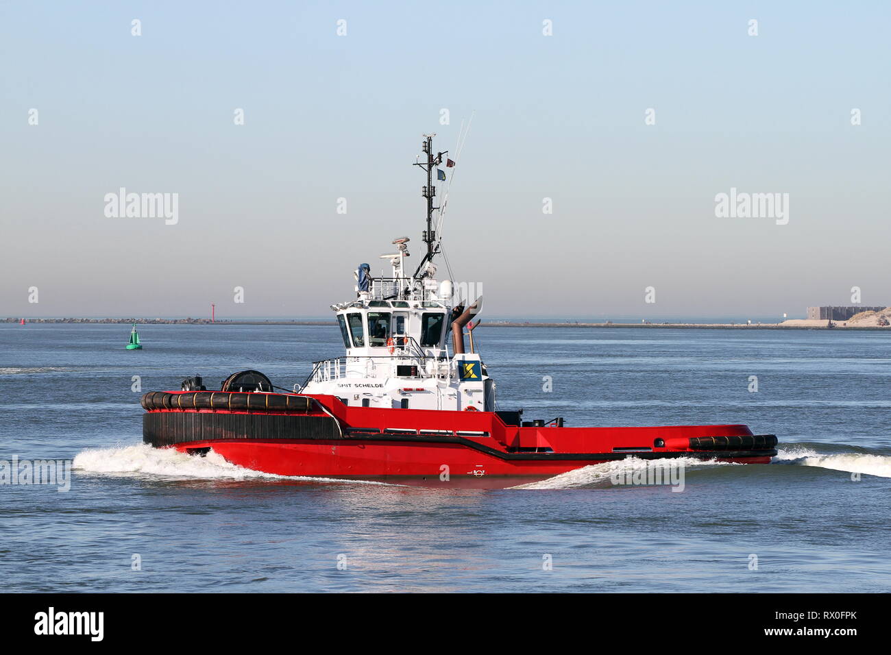 The harbor tug Smit Schelde works on 15 February 2019 in the port of Rotterdam. Stock Photo