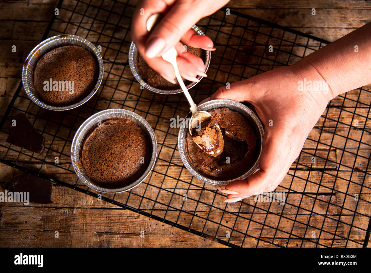 Person eating molten chocolate cake close up Stock Photo