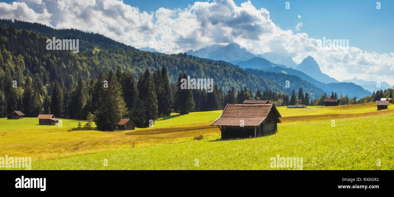 Great view of the green alpine valley glowing in sunlight. Dramatic and