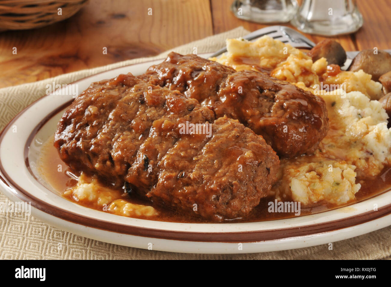 Meatloaf dinner with mashed potatoes, gravy and sauteed mushrooms Stock