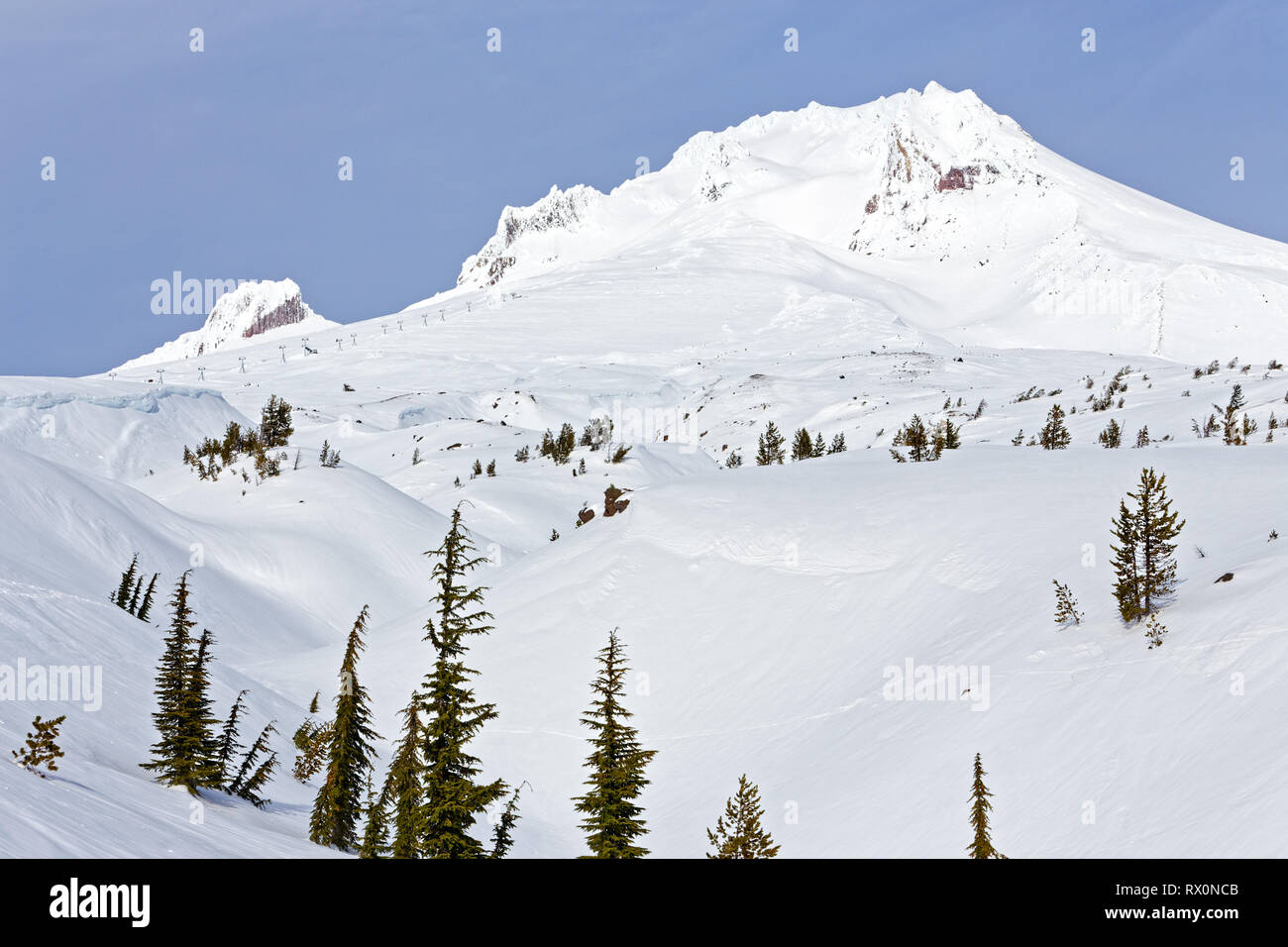 43,489.03922 – Mount Hood’s beautiful snow covered winter landscape with many enticing ravines, gullies and ridges leading to the top of the mountain Stock Photo