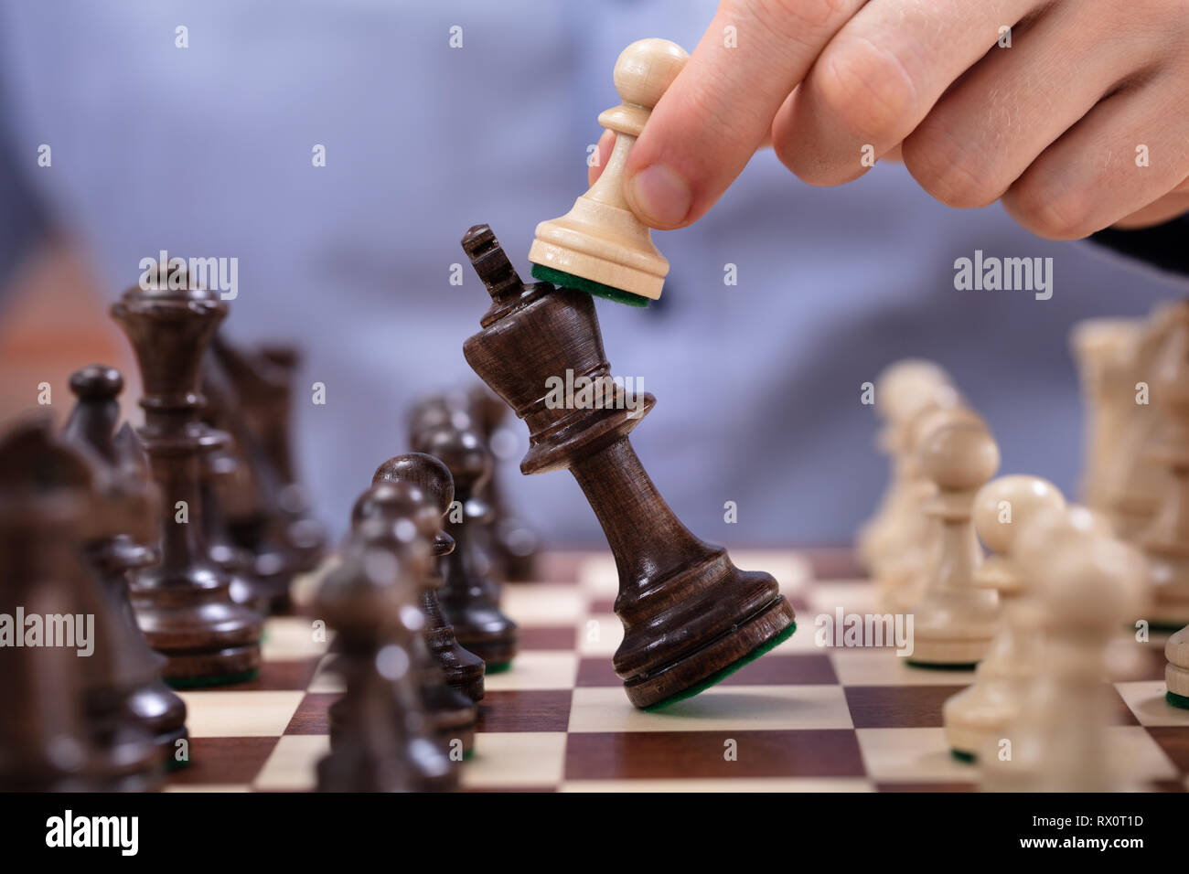 Chess Player Makes A Move To Defeat King Piece Stock Photo