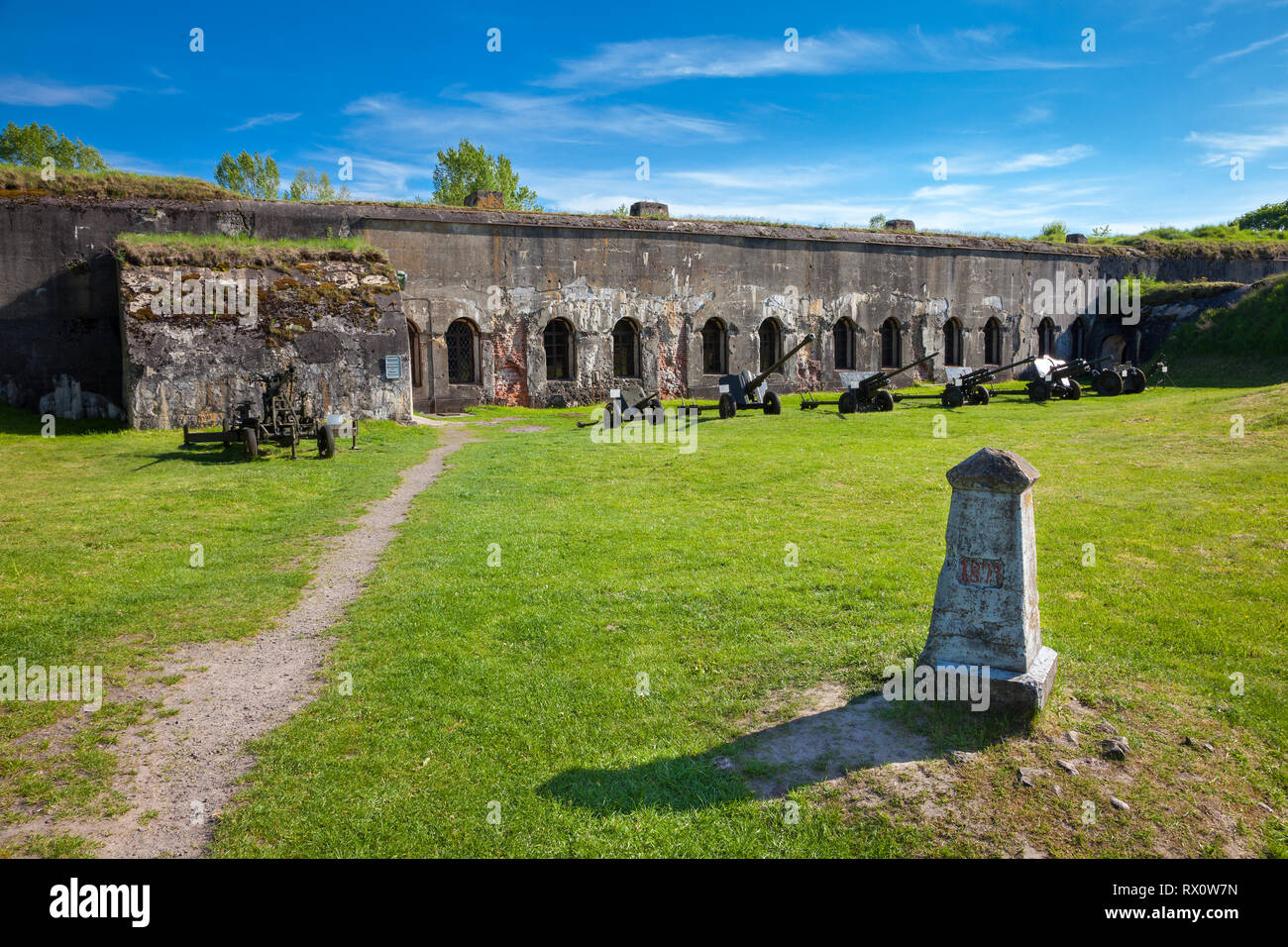 Brest, Belarus - May 12, 2015: The Fifth Fort of Brest Fortress in Belarus. Was built in 1878. Old canons near building. Brest, Belarus. Stock Photo