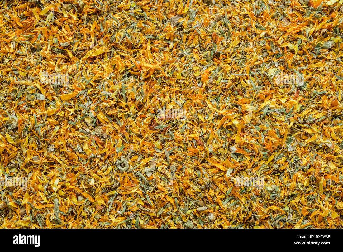 Background of dry calendula flowers, dried marigold petals. Top view