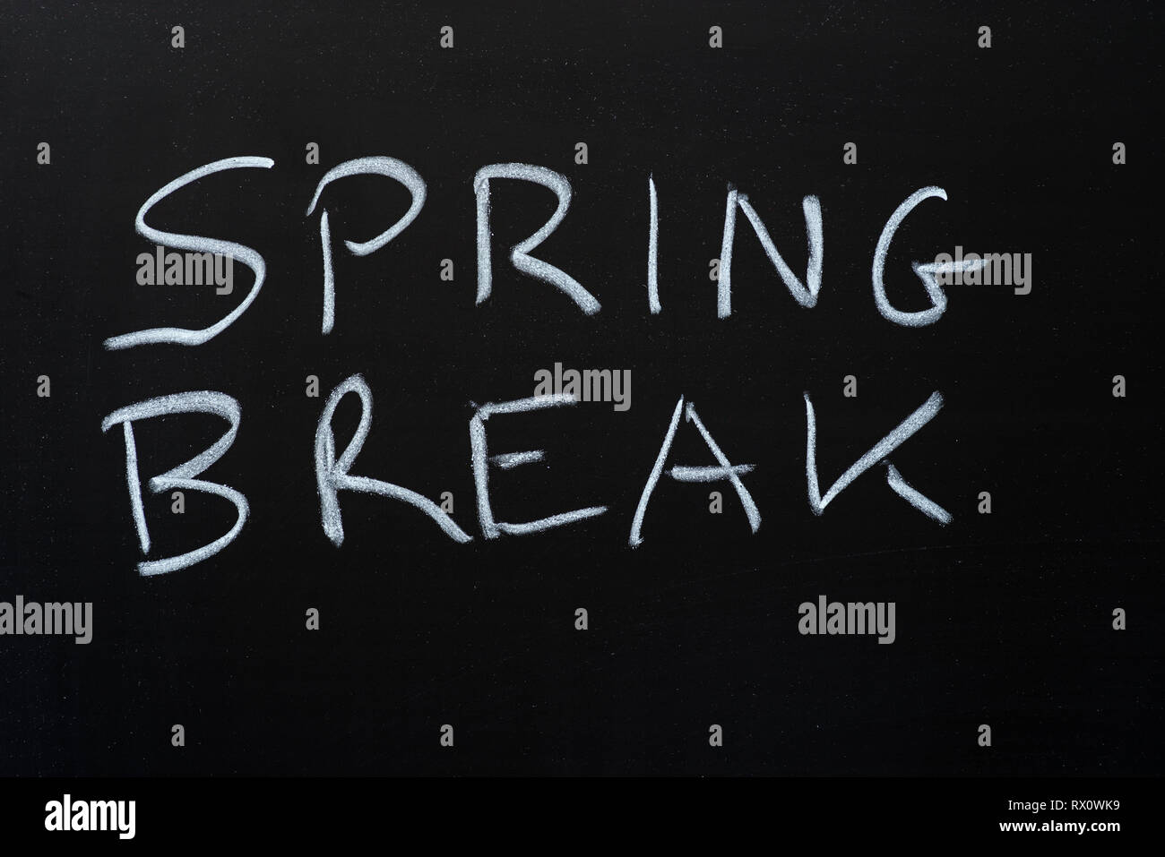 spring break written with chalk on blackboard Stock Photo