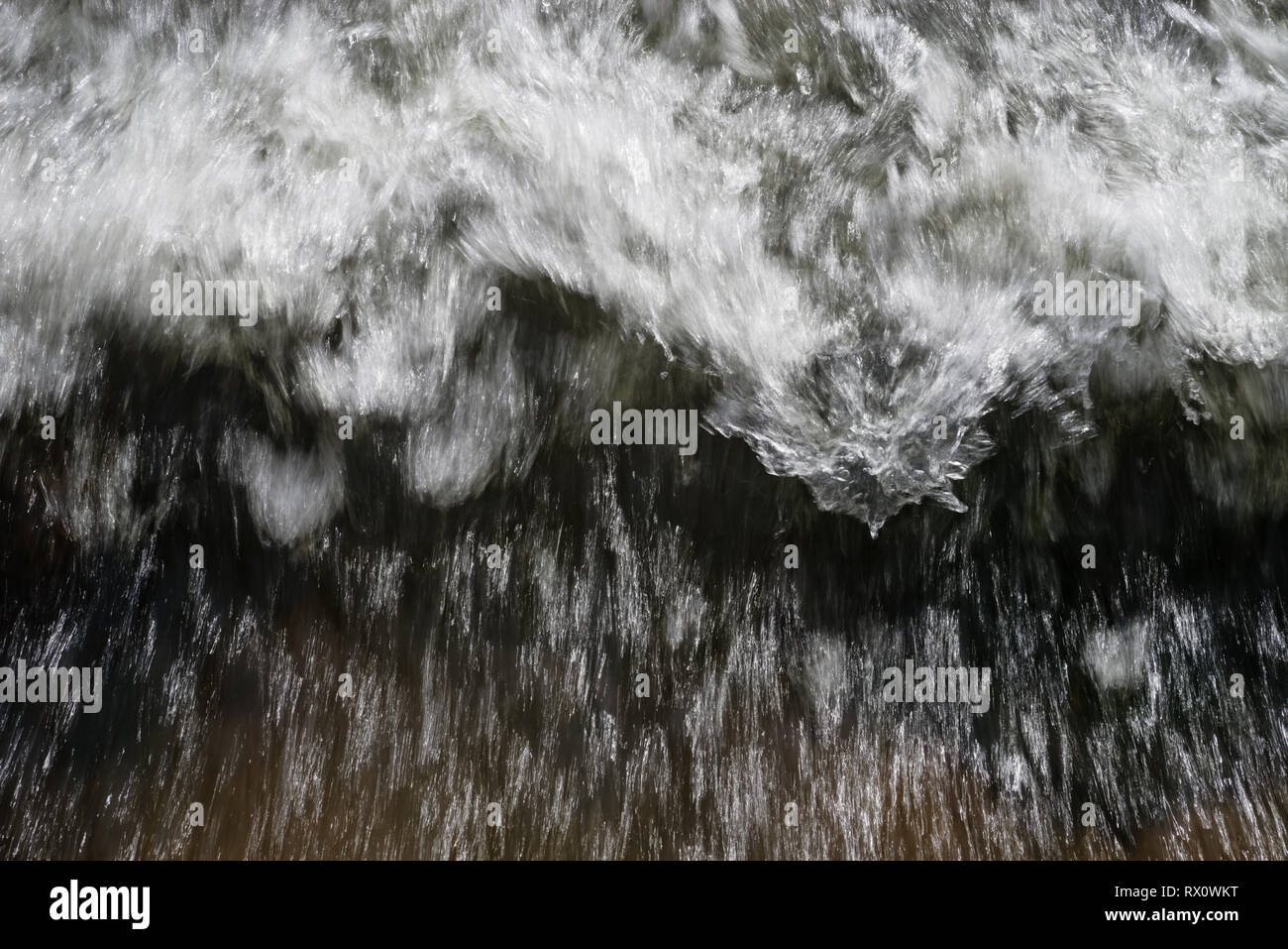 rushing water with motion blur and white waves Stock Photo