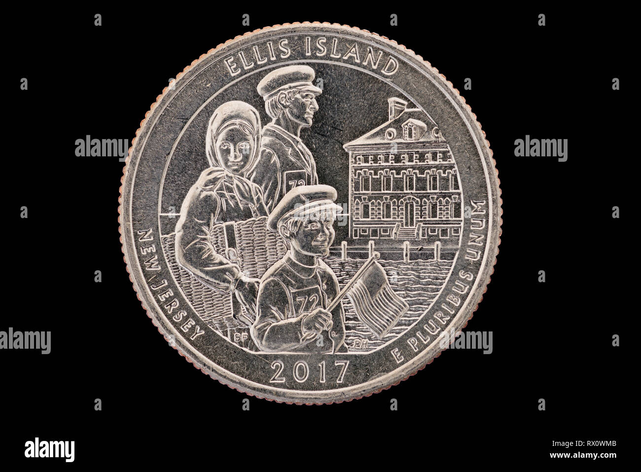 Ellis Island New Jersey commemorative quarter coin isolated on black Stock Photo