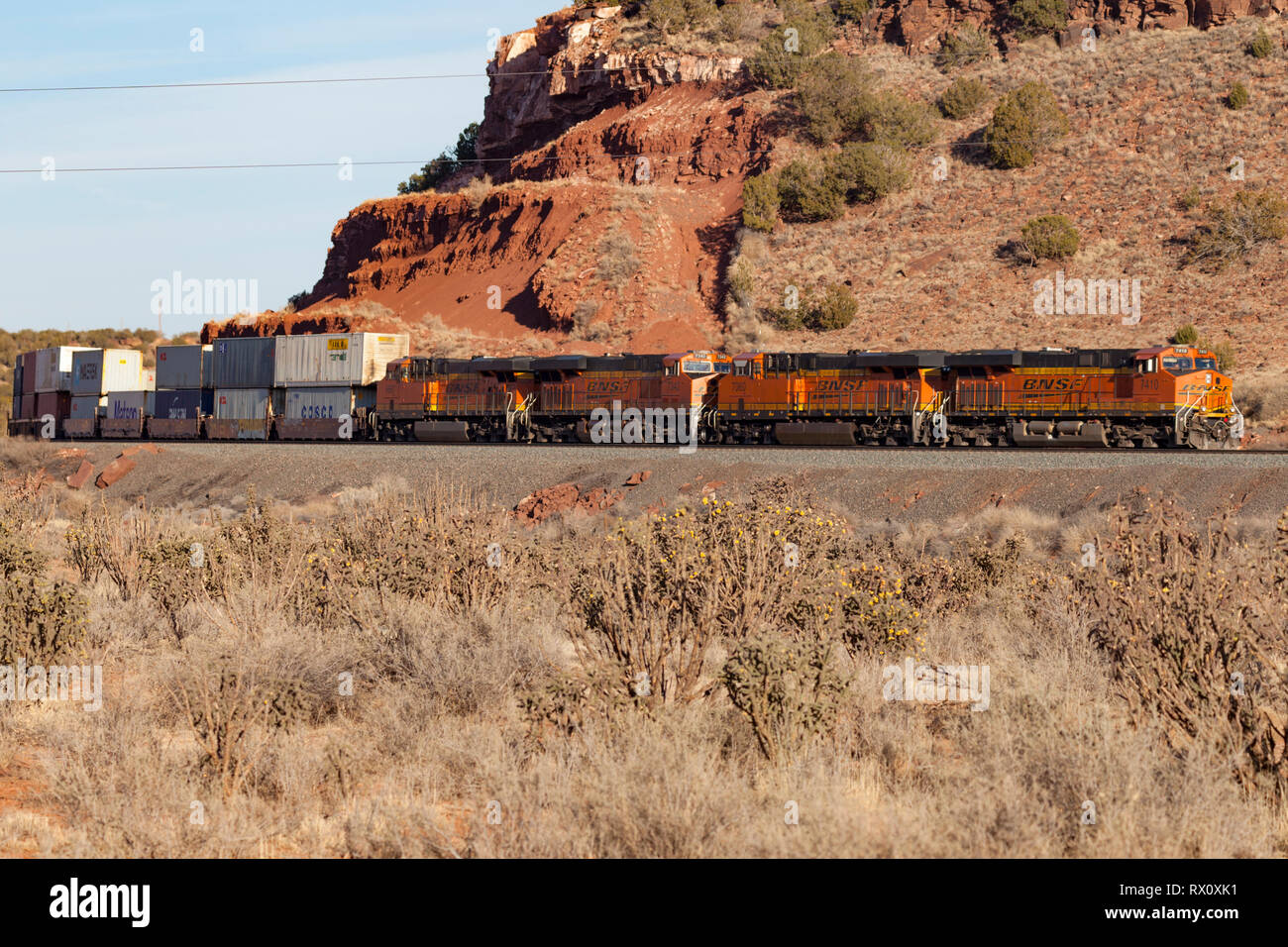Double stacked freight train in New Mexico desert Stock Photo