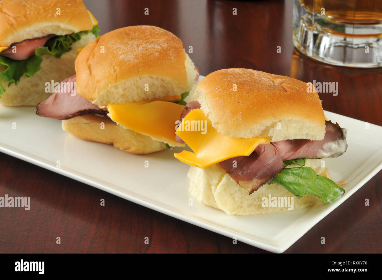 Roast beef and cheese sliders and beer on a bar counter Stock Photo