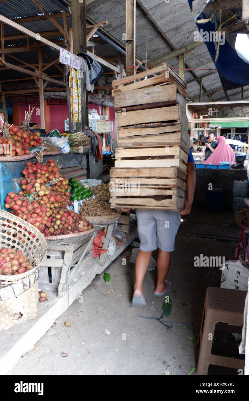 someone is carrying goods in a traditional market Stock Photo Alamy