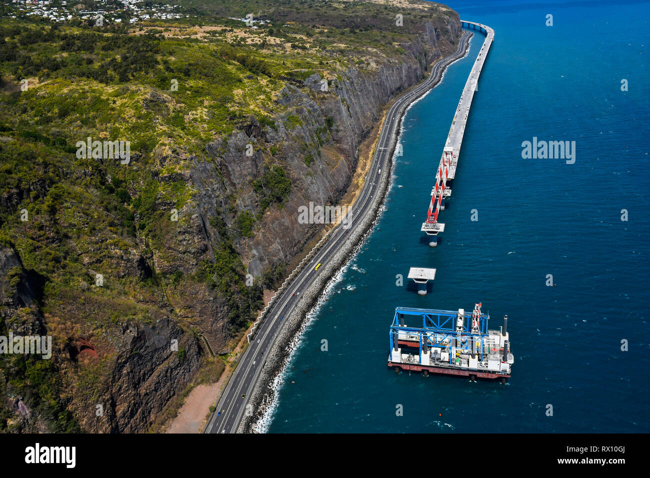 Reunion Island, aerial view of the construction site of the new divided highway (NRL or ' Nouvelle route du littoral). A 13-km long coastal road that  Stock Photo