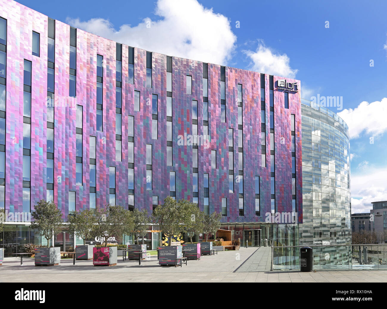 The new 'W' Aloft hotel next to the Excel Exhibition Centre in London's docklands district, east of the City. Shows multi-coloured metallic cladding. Stock Photo